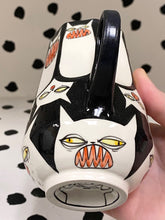 Load image into Gallery viewer, Spinning Cats with Yellow Eyes
