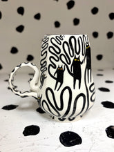 Load image into Gallery viewer, Spinning Black Cat Mug
