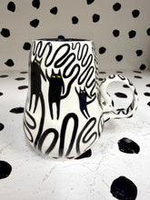 Load image into Gallery viewer, Spinning Black Cat Mug
